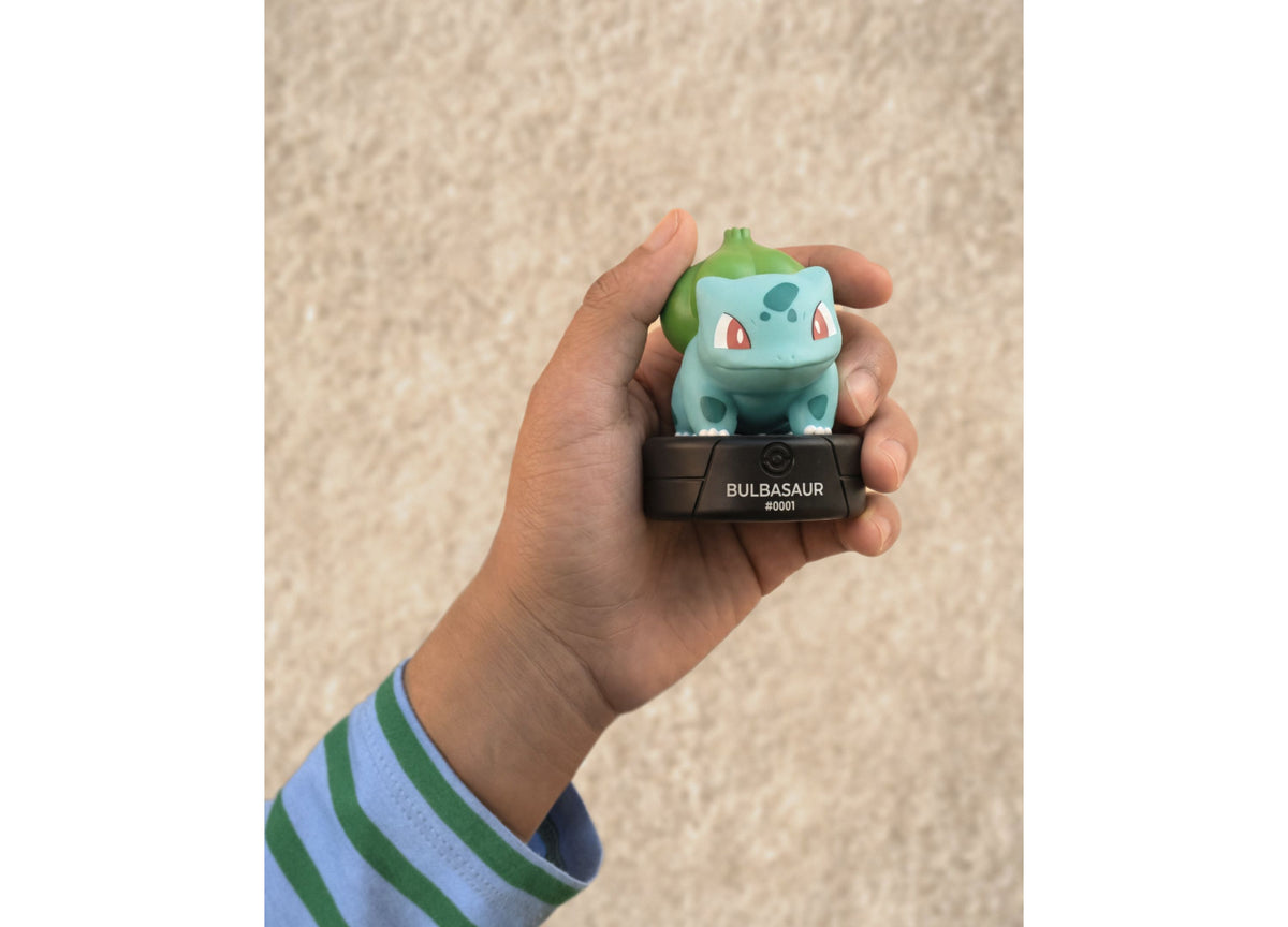 Tonies Pokemon Bulbasaur #0001 Tonie figure held in hand, light blue and green collectible toy