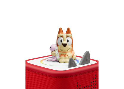 Tonies Bluey Tonie figurine set with orange dog character and accessories on red speaker