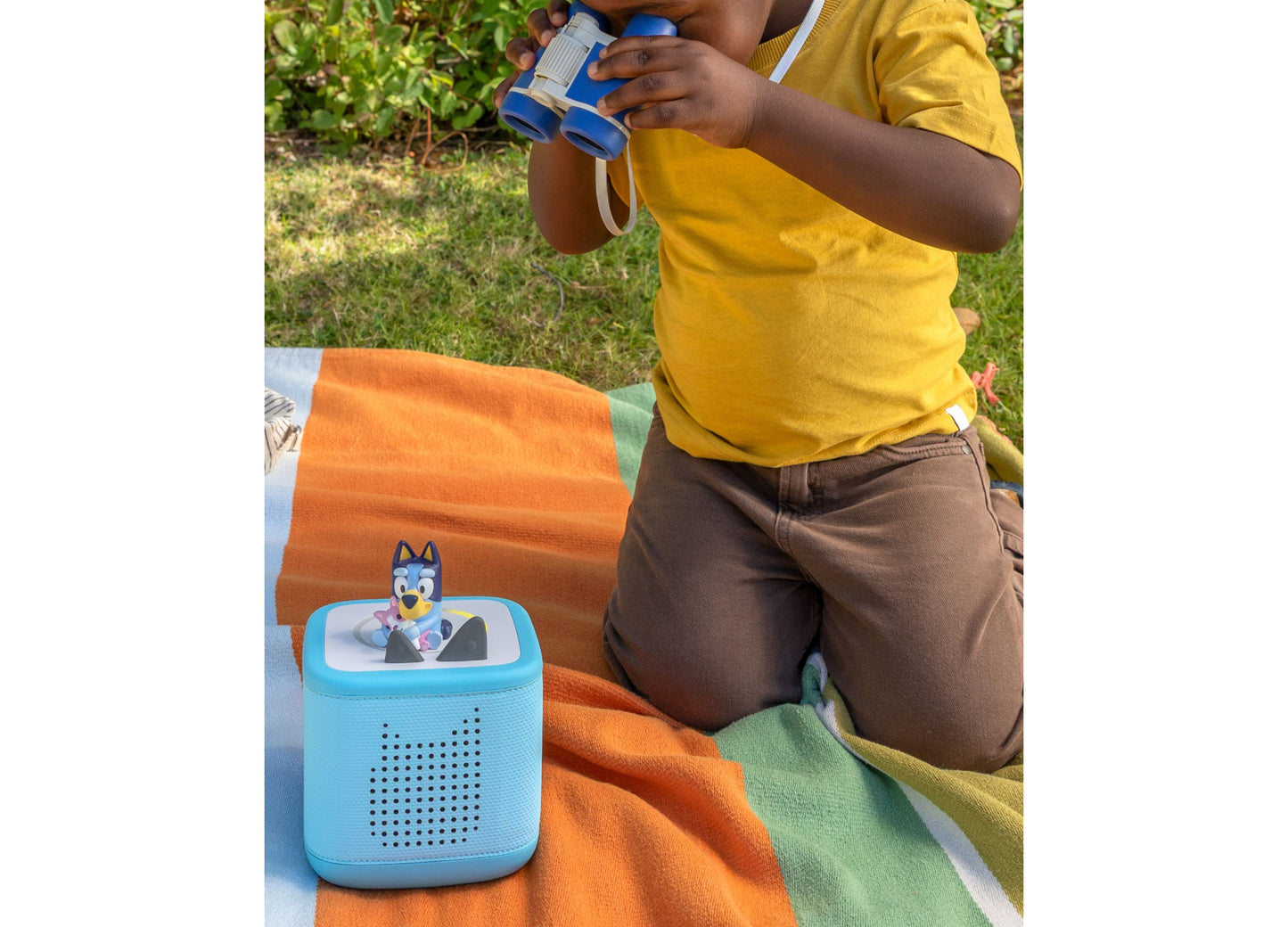 Tonies Bluey Toniebox 2 starter set with blue speaker and binoculars outdoors