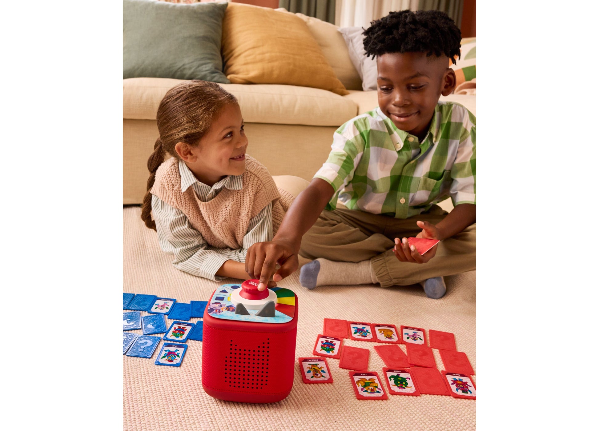 Tonies Guess Who Monster Mysteries screen-free game with red speaker device and colorful card tiles