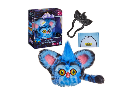 Furby KPop Demon Hunters blue interactive plush with spiky hair, large eyes, and pink ears, shown with removable clip