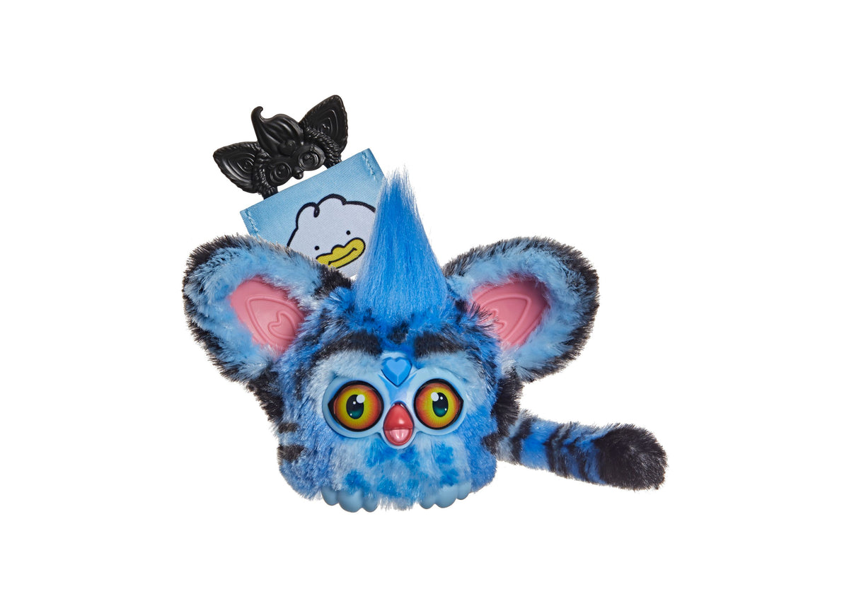 Blue Furby KPop Demon Hunters Derpy Tiger interactive plush with large orange eyes, pink inner ears, and black butter...