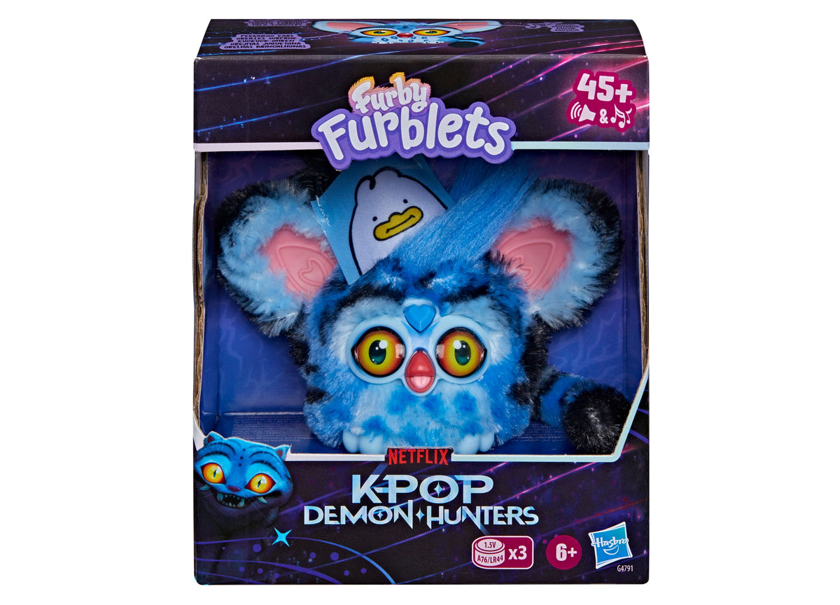Furby KPop Demon Hunters blue and black interactive plush with yellow eyes, pink nose, and removable clip