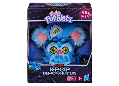 Furby KPop Demon Hunters blue and black interactive plush with yellow eyes, pink nose, and removable clip