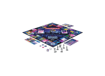 Monopoly KPop Demon Hunters Edition board game with purple and blue game board, character pieces, cards, and dice