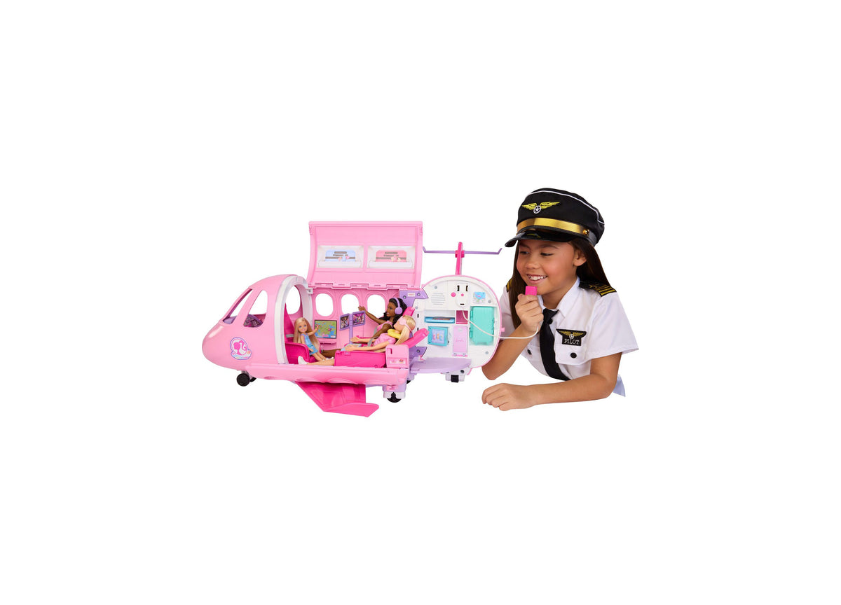 Barbie Dream Plane 15-piece airplane playset in pink with child in pilot outfit demonstrating the toy