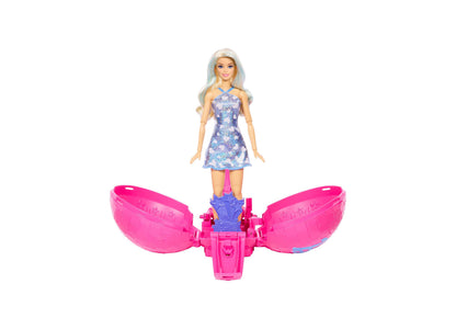 Barbie Roll & Reveal Pop Star doll with light blue hair in purple sequin dress, standing on pink rolling ball base wi...