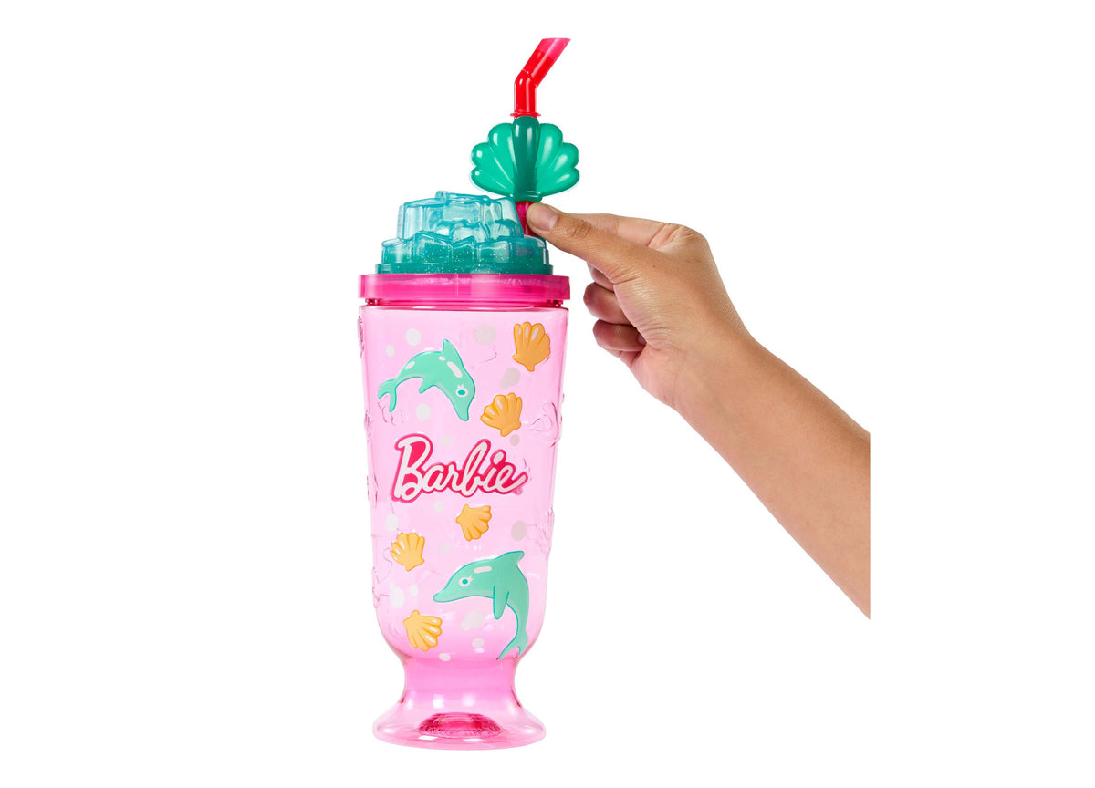 Barbie Pop Reveal Sea Slushy doll with teal shell-shaped top and pink body featuring dolphin and seashell designs