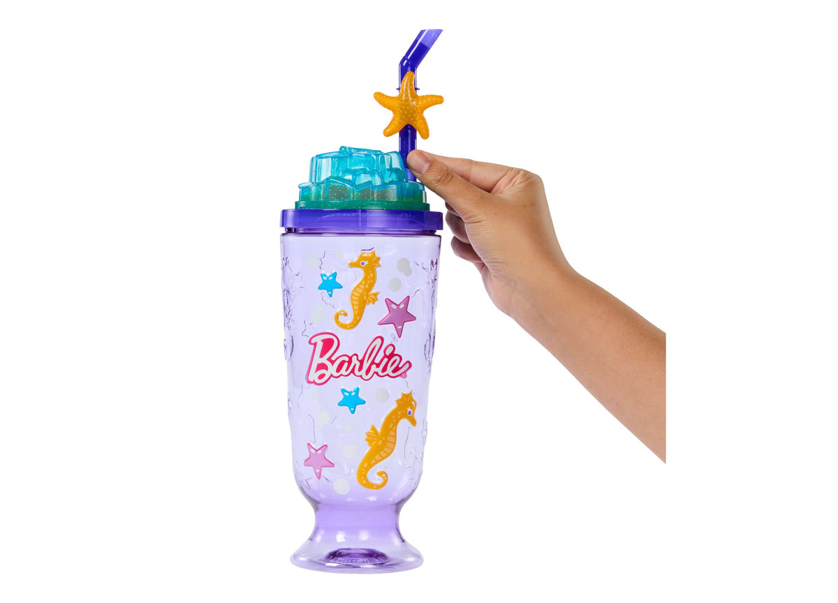 Barbie Pop Reveal Sea Slushy doll with purple cup featuring starfish and seahorse designs, turquoise lid, and gold st...