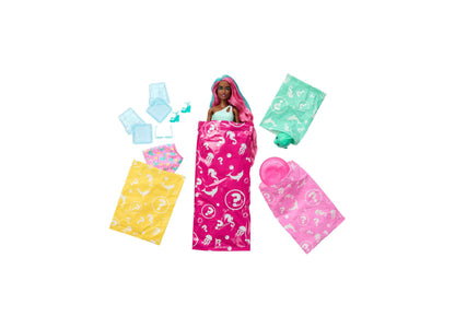 Barbie Pop Reveal Sea Slushy Series doll with pink hair in magenta wrapper, surrounded by colorful accessory packets ...