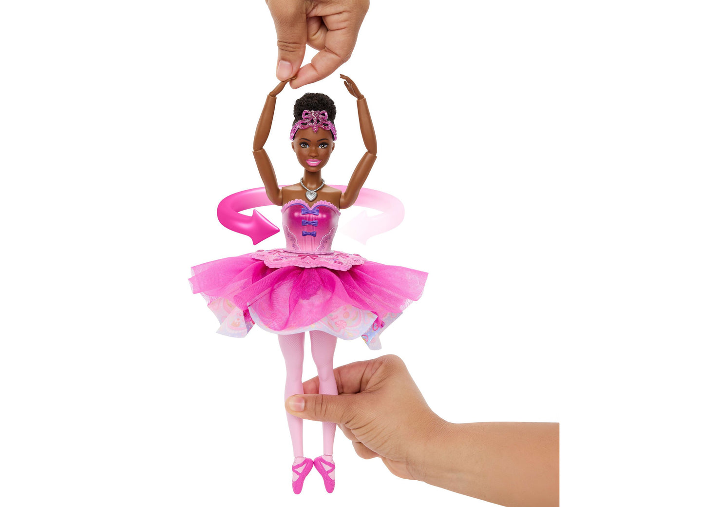 Barbie in the Nutcracker Sugar Plum doll in pink tutu with arms raised, held in hands