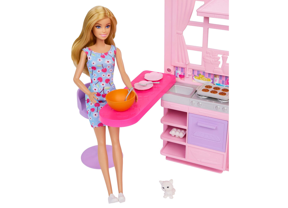 Barbie Weekend Escape Foldable Dollhouse with Barbie doll in blue cherry-print dress, pink kitchen playset, and white...