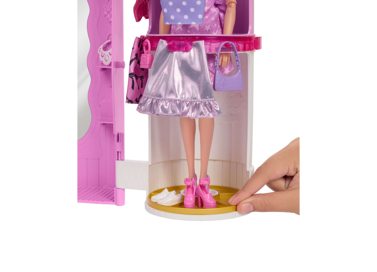 Barbie Deluxe Style Closet playset with doll wearing silver skirt and pink boots on rotating base