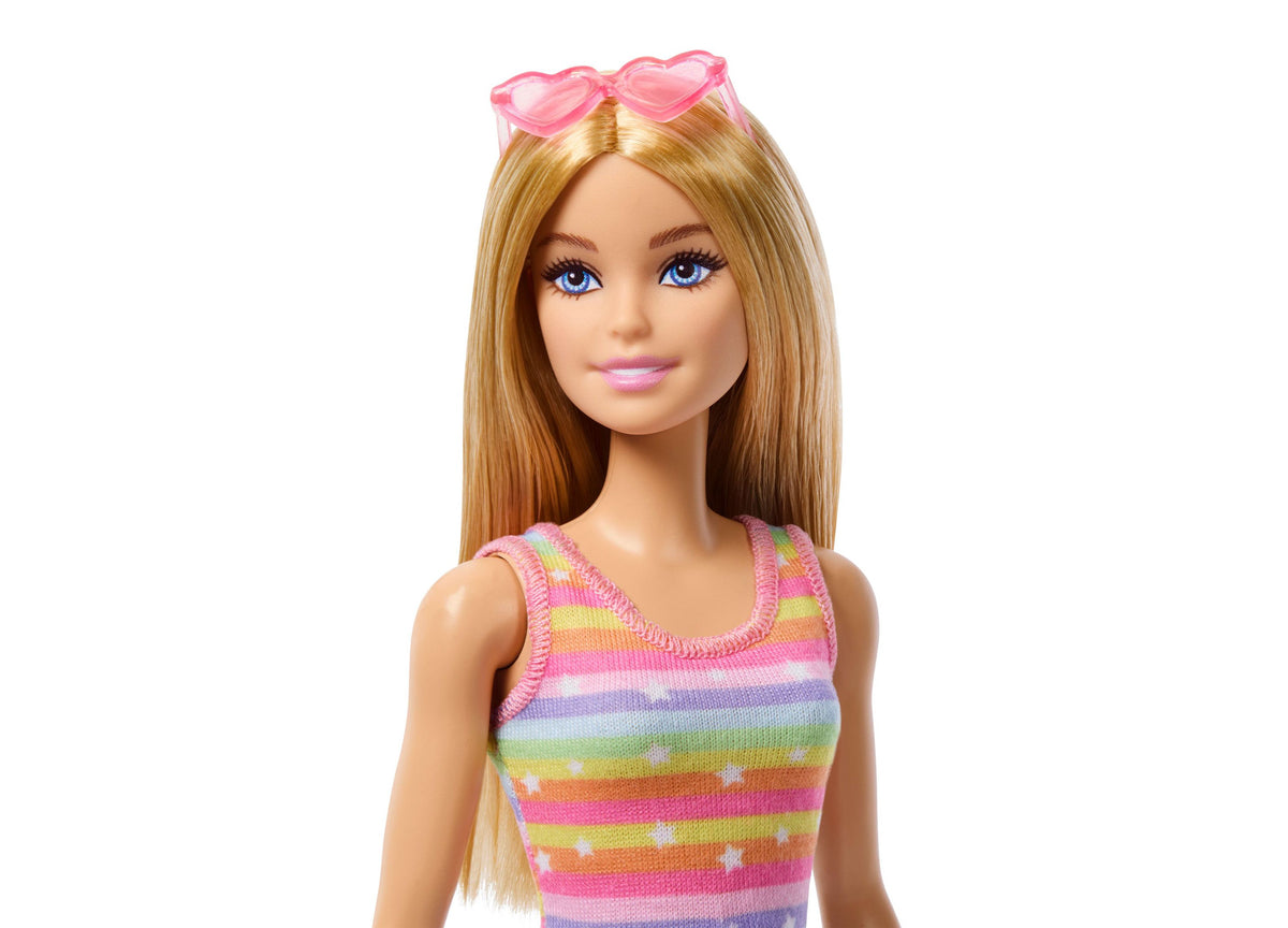 Barbie Skate and Run Pup fashion doll with blonde hair, blue eyes, pink heart-shaped sunglasses, and colorful rainbow...