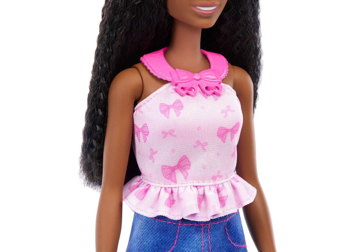 Barbie Brooklyn brunette doll wearing pink bow-print top with ruffled hem and blue bottoms