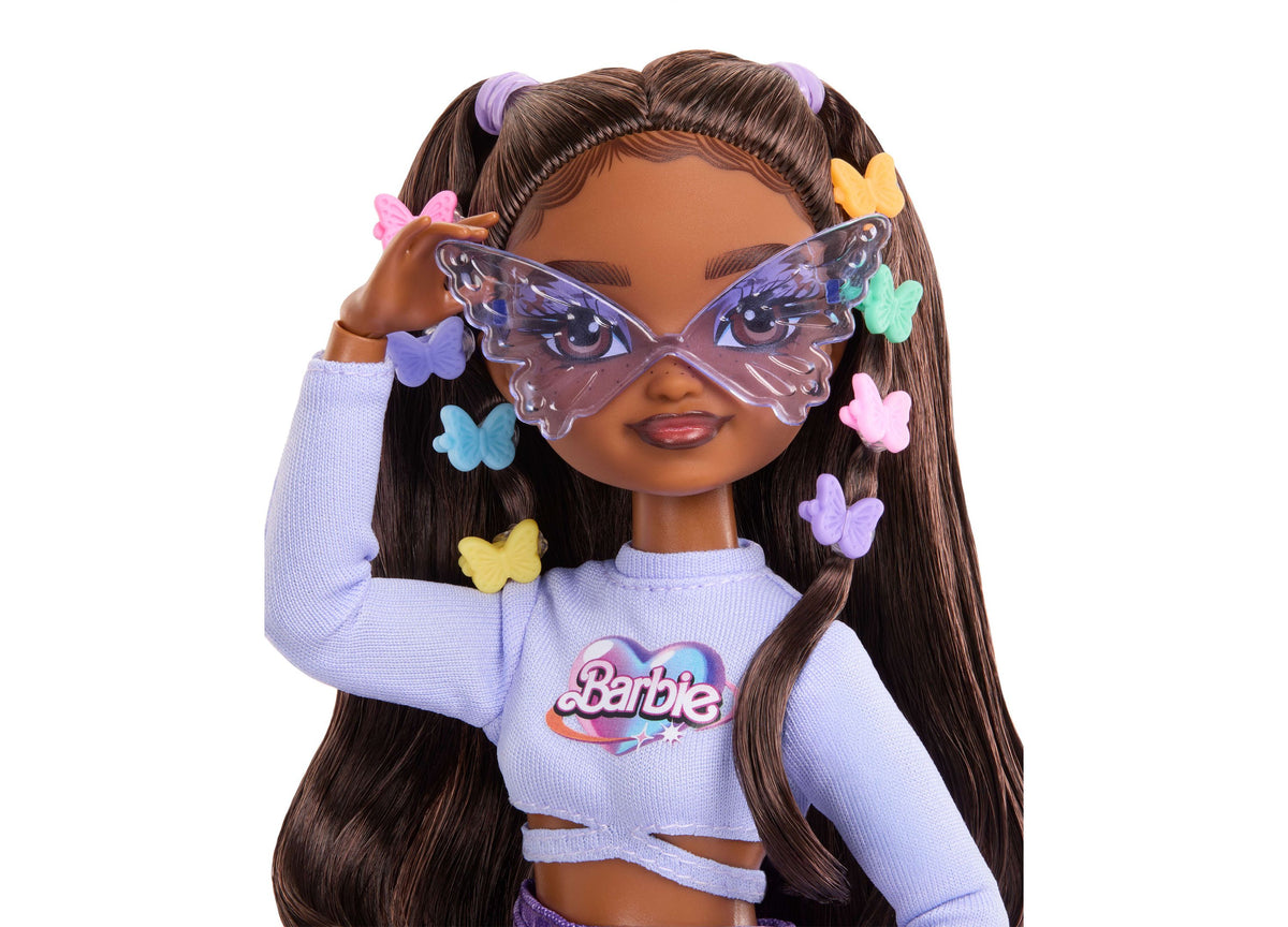 Barbie Dream Besties Brooklyn fashion doll with long brown hair in pigtails, wearing lavender crop top, butterfly mas...