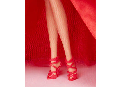 Barbie 2026 Holiday doll wearing red strapless gown with bow detail and matching red shoes