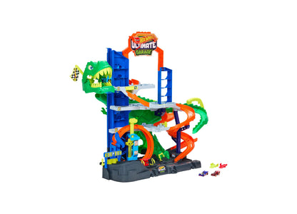 Hot Wheels Ultimate T-Rex Garage Playset with green dinosaur, blue tower, orange tracks, and 2 die-cast cars