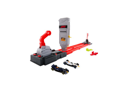 Hot Wheels 1:64 Scale Formula 1 Grid Start Track Set with red launcher, gray tower, and two die-cast F1 cars