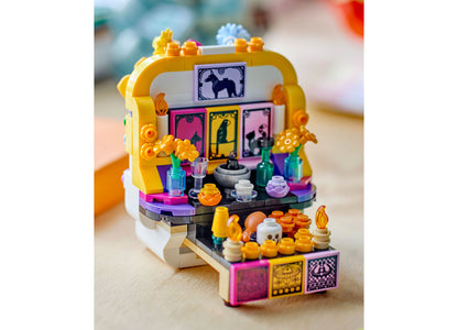 LEGO Día De Los Muertos Altar of the Dead 40811 building set with yellow frame, colorful decorative pieces, and detai...