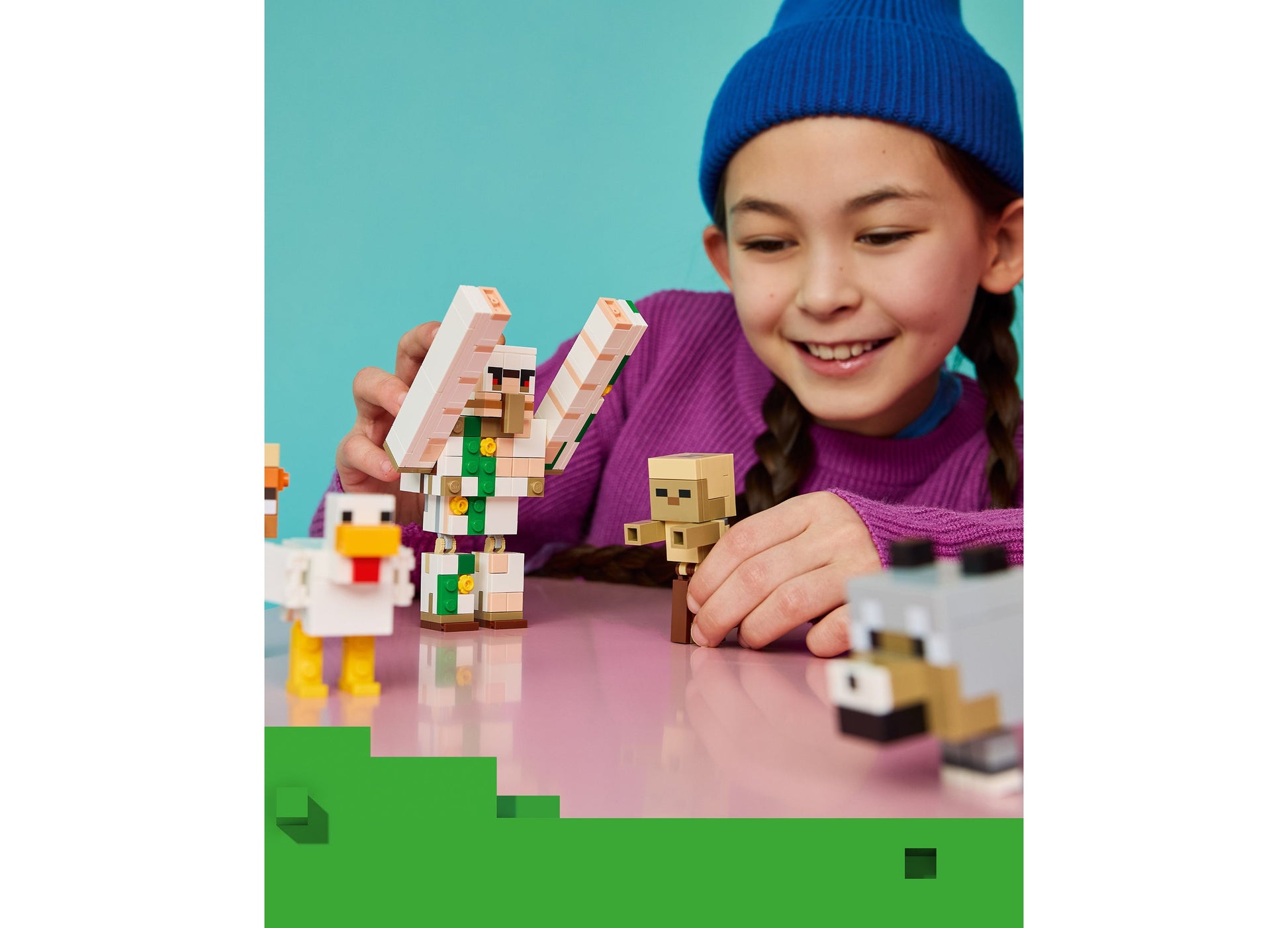 Child playing with LEGO Minecraft Chicken Jockey Desert Attack set featuring colorful pixel figures