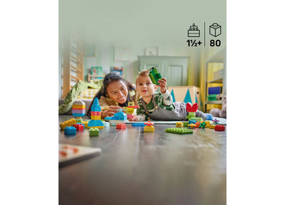 LEGO DUPLO Classic Colorful Creative Box 80-piece set with two toddlers building colorful stacked blocks