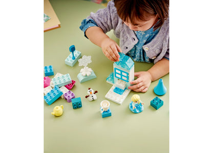LEGO Disney Frozen Creative Box with Elsa and Olaf figures, blue and white building blocks, and accessories arranged ...