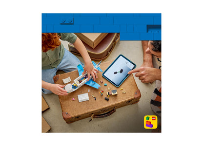 LEGO City Passenger Jet 60492 building set with blue pieces displayed on wooden suitcase