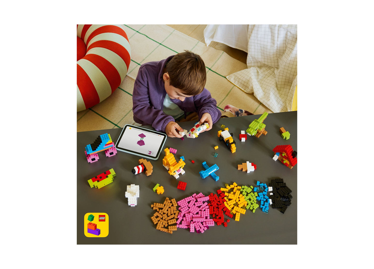 LEGO Classic Creative Colorful Bricks 11045 set with 820 pieces in multiple colors, child building with tablet guide