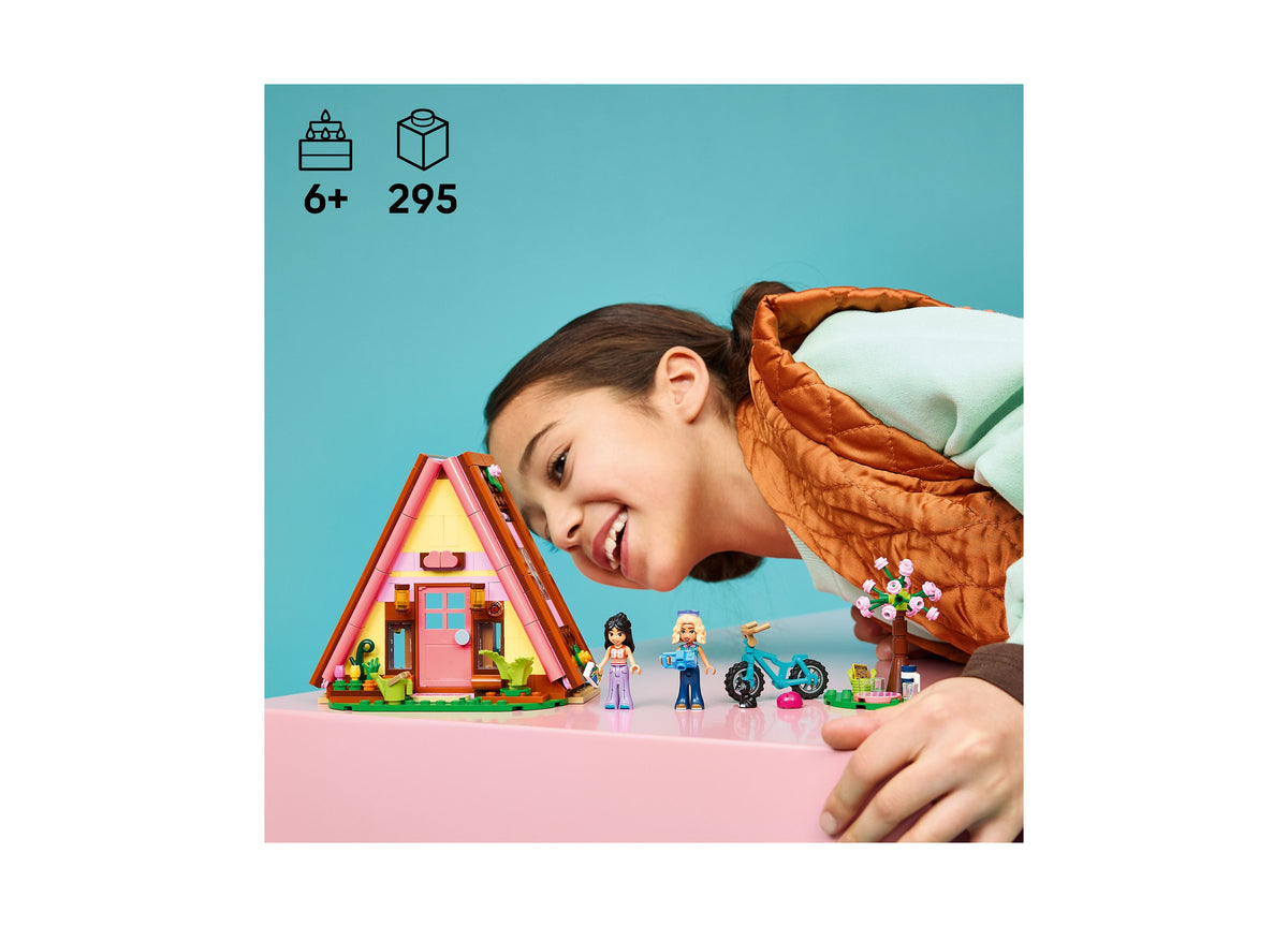 LEGO Friends Nature Glamping Cabin 42682 building set with colorful pink cabin, minifigures, and accessories for ages 6+