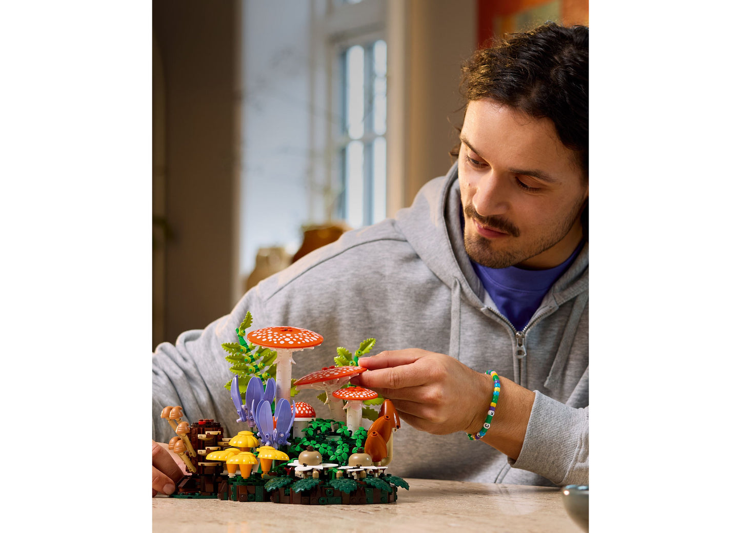 LEGO Botanicals Woodland Mushrooms set with red and white mushrooms, purple flowers, and forest elements