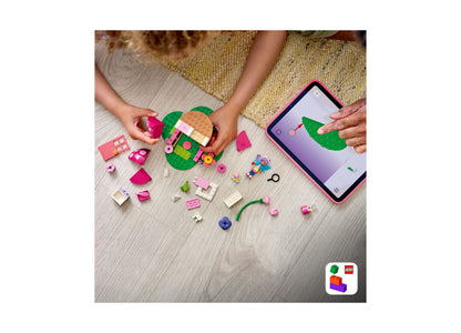 LEGO Gabby's Dollhouse Kitty Fairy's Garden House building set with pink and green pieces displayed on wooden floor n...