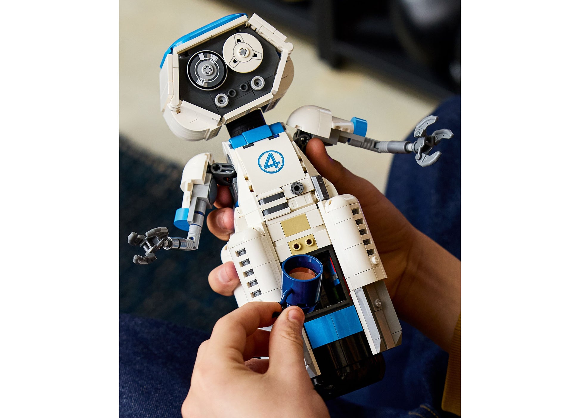 LEGO Marvel Fantastic Four H.E.R.B.I.E. 76339 robot toy in white and blue held in hands