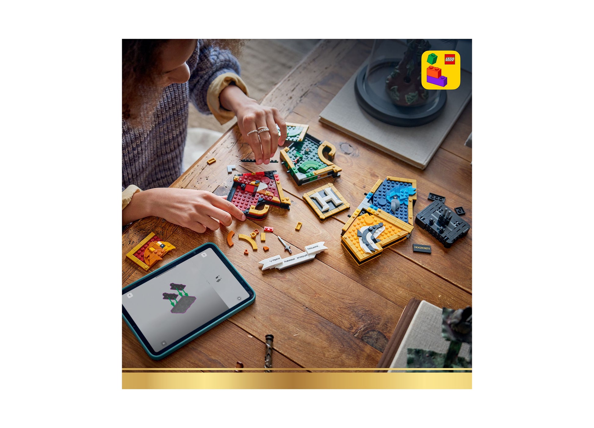 LEGO Harry Potter Hogwarts House Crest 76462 building set with colorful brick pieces displayed on wooden table