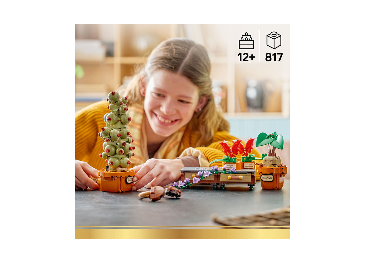 Girl playing with LEGO Harry Potter Hogwarts Herbology Plants set featuring green and red decorative plants