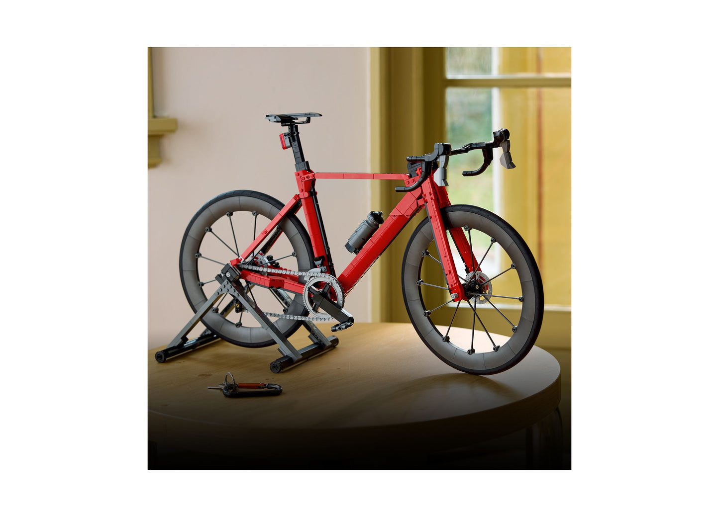 LEGO Icons Road Bike 11380 red and black buildable bicycle set displayed on stand