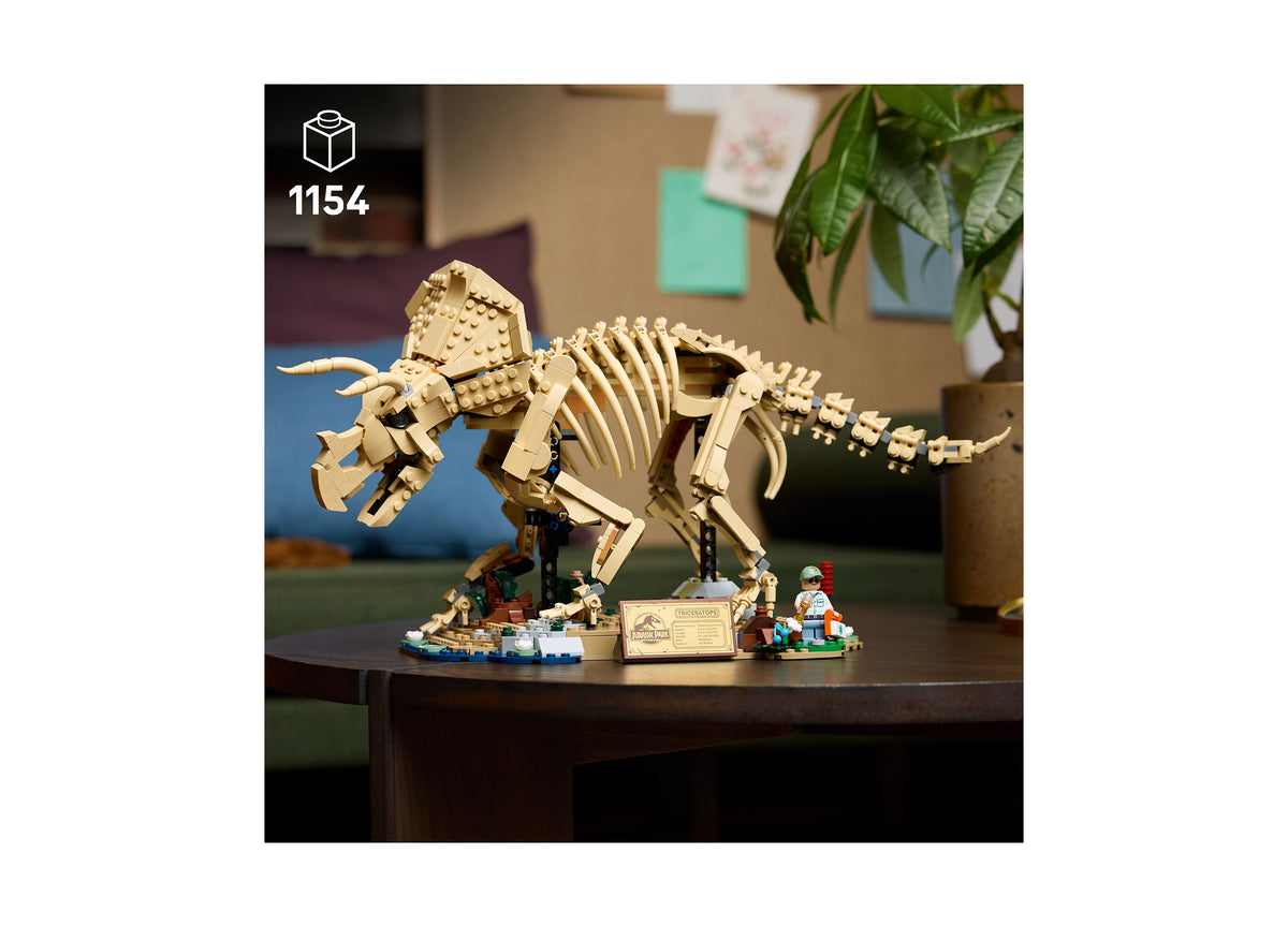 LEGO Jurassic World Triceratops fossil building set with cream-colored skeletal model on display stand with minifigure