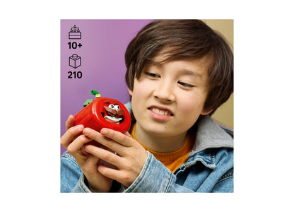 LEGO Fortnite Tomatohead 77079 red character building set held by child, 210 pieces