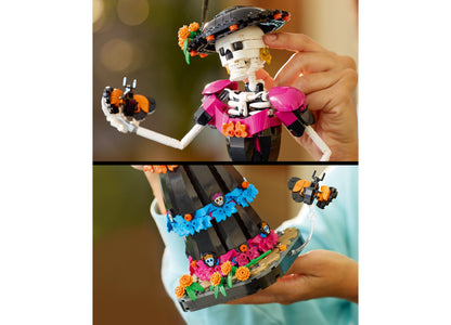 LEGO Ideas Day of the Dead La Catrina building set with poseable skeleton figure, colorful marigolds, and monarch but...