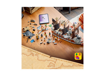 LEGO One Piece Garp's Marine Battleship 75646 set with 1,705 pieces displayed on wooden table with minifigures and in...