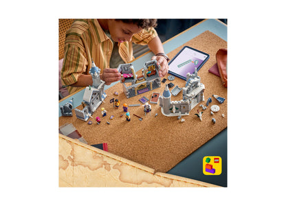 LEGO One Piece Battle at Drum Castle 75645 set with castle, minifigures, and accessories displayed on cork board