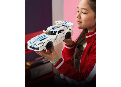 LEGO Technic Dodge Viper GTS-R white and blue sports car model held by child