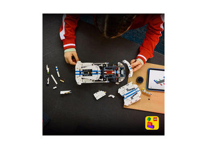 LEGO Technic Dodge Viper GTS-R Sports Car 42234 building set with white and blue pieces being assembled by child