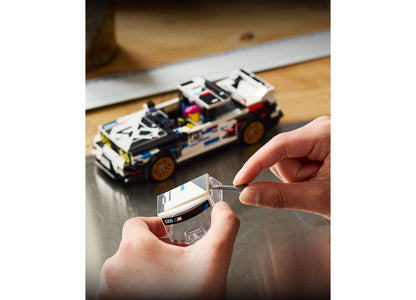 LEGO BMW M3 E30 77263 white and black racing car set held in child's hands