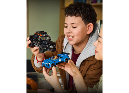 LEGO Jaguar Project 7 Land Rover Defender 77264 black SUV and blue sports car models held by children
