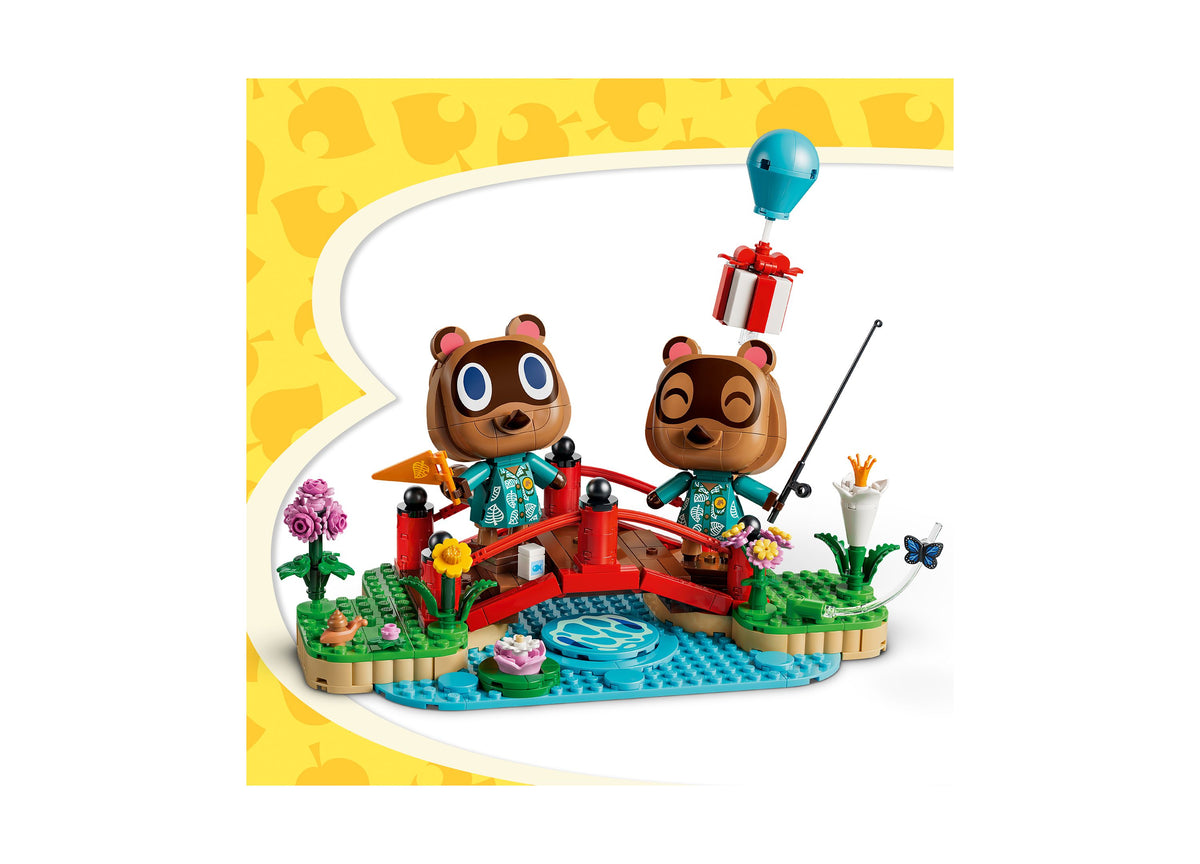 LEGO Animal Crossing Timmy Tommy's Fun Day Out set with two bear characters, red bridge, flowers, and blue balloon on...