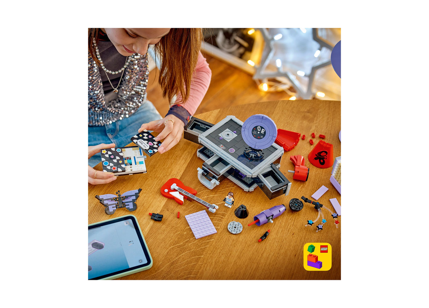 LEGO Olivia Rodrigo Secret Storage 43030 building set with purple and red pieces displayed on wooden table