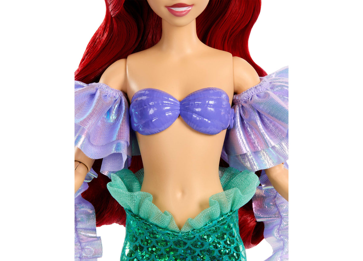 Disney Princess Ariel doll with red hair, purple shell top, green sequined tail, and removable purple sleeves