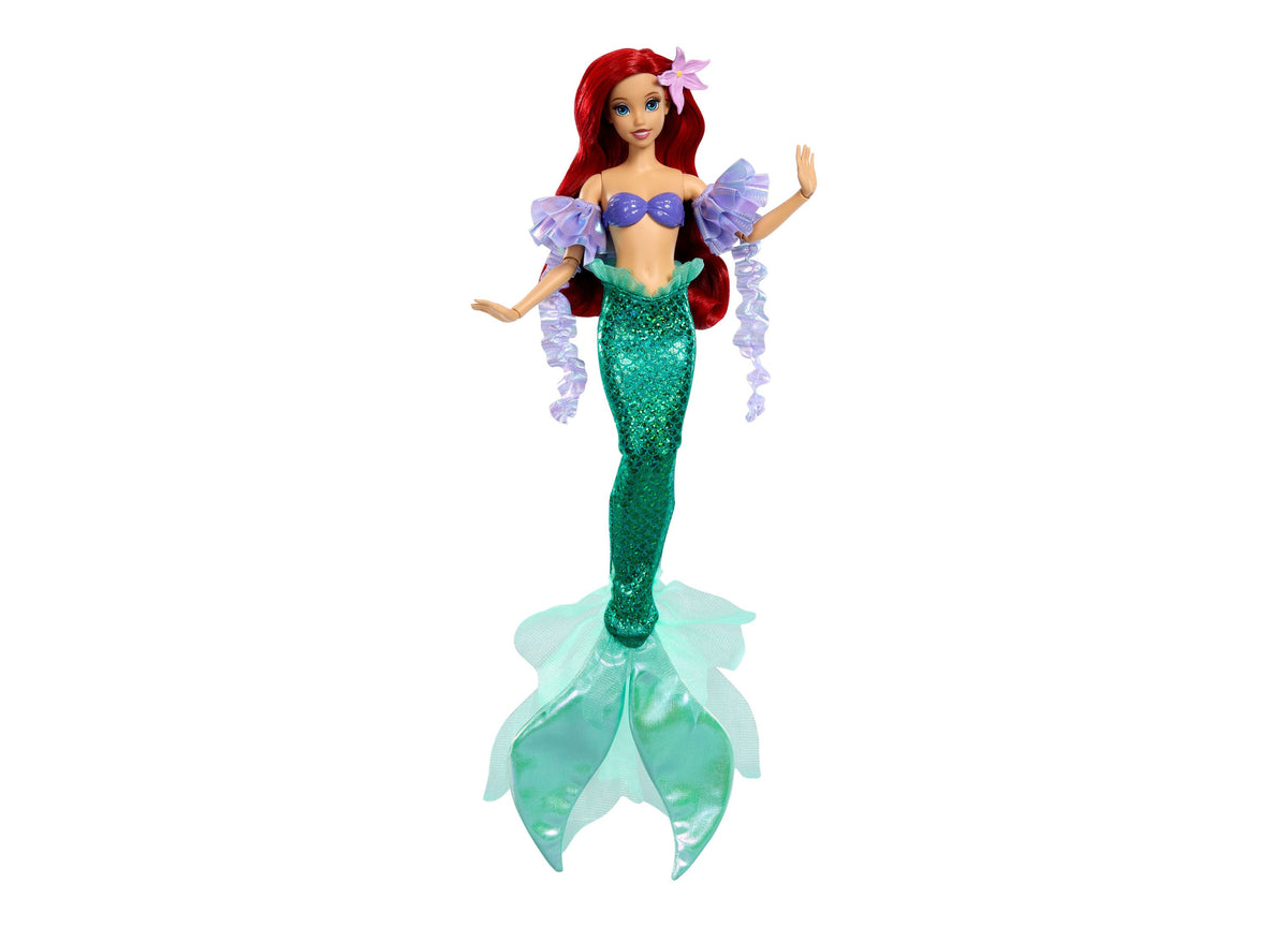 Disney Princess Ariel doll with red hair, purple off-shoulder top, green sequined tail, and removable purple sleeves