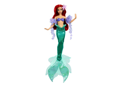 Disney Princess Ariel doll with red hair, purple off-shoulder top, green sequined tail, and removable purple sleeves